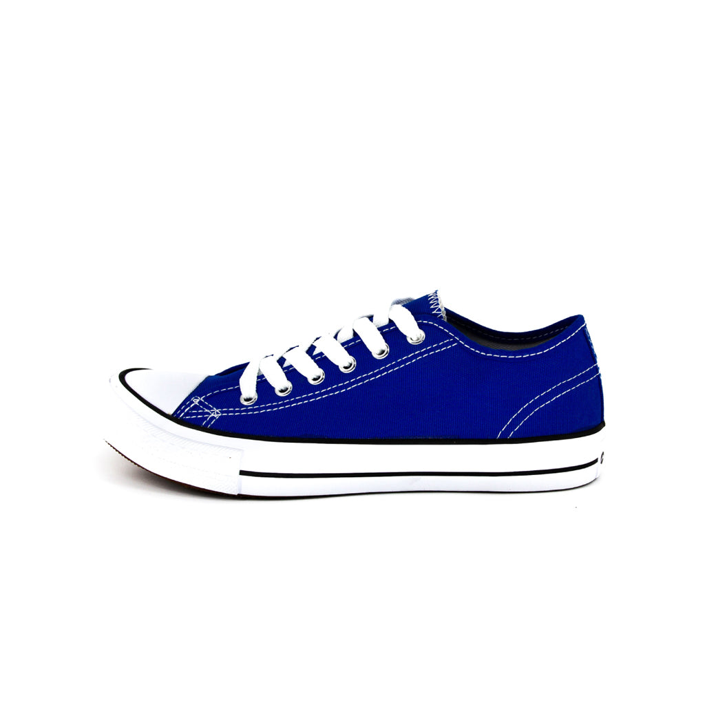 รองเท้าผ้าใบแฟชั่น รุ่น 1207 สีน้ำเงิน โชว์หน้าผ้าแคนวาสและเส้นคาดขอบยางสุดคลาสสิก มุมมองด้านข้าง