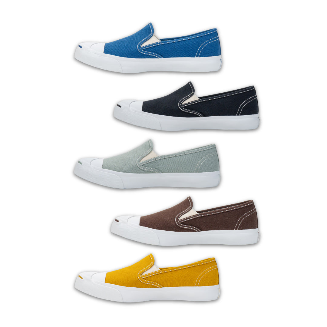 รองเท้าผ้าใบ รุ่น NS234 วางเรียงกัน 5 คู่ โชว์ดีไซน์กุ๊นขอบ สีดำ สีเ สีมัสตาร์ด สีน้ำทะเล สีน้ำตาล มุมมองด้านข้างียวอ่อน
